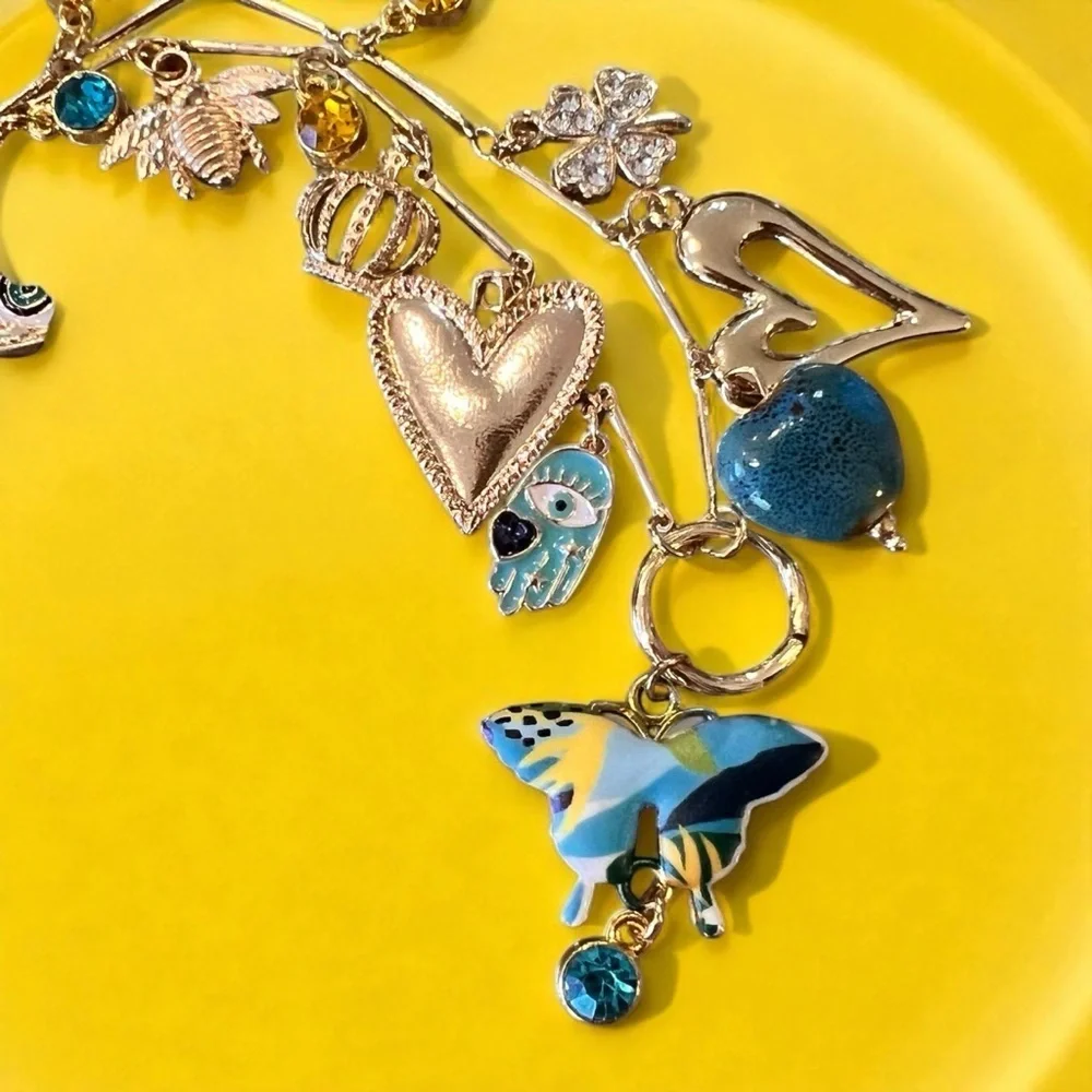 Unique and Gorgeous Gold toned Necklace with Varying Blue and Yellow Charms